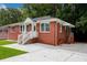 Brick Ranch home with a large front yard, driveway, and landscaping at 690 Green Acres Se Rd, Smyrna, GA 30080