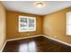 Bright bedroom with hardwood floors and large window at 690 Green Acres Se Rd, Smyrna, GA 30080