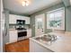 Updated kitchen, featuring stainless steel appliances and light wood flooring at 690 Green Acres Se Rd, Smyrna, GA 30080