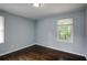 Charming bedroom with hardwood floors and a window with natural light at 690 Green Acres Se Rd, Smyrna, GA 30080