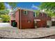 Brick Ranch home with a large backyard, patio, and landscaping at 690 Green Acres Se Rd, Smyrna, GA 30080