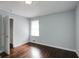 Bright bedroom with dark hardwood floors and spacious closet at 690 Green Acres Se Rd, Smyrna, GA 30080