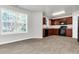 Eat-in kitchen with wood cabinets and a large window at 2146 Silva Ct, Conley, GA 30288