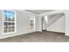 Bright living room with large windows and grey floors at 2146 Silva Ct, Conley, GA 30288