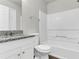 Bathroom with granite countertop, tub, and shower at 2146 Silva Ct, Conley, GA 30288