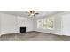 Living room with fireplace and neutral color palette at 2146 Silva Ct, Conley, GA 30288