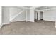 Open living room with grey wood-look floors at 2146 Silva Ct, Conley, GA 30288