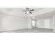 Ample main bedroom featuring a ceiling fan and carpet at 2146 Silva Ct, Conley, GA 30288