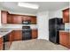 Modern kitchen with black appliances and granite countertops at 2146 Silva Ct, Conley, GA 30288