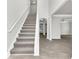 Bright foyer with grey carpet staircase at 2146 Silva Ct, Conley, GA 30288