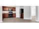 Modern kitchen with dark wood cabinets and granite counters at 2146 Silva Ct, Conley, GA 30288