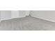 Bright bedroom featuring grey carpet and an open door at 2146 Silva Ct, Conley, GA 30288