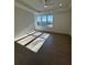 Bright and airy bedroom with hardwood floors and large windows at 130 Chiswick Cir, Alpharetta, GA 30009