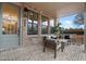 Inviting front porch with brick flooring and seating area at 130 Chiswick Cir, Alpharetta, GA 30009