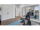 Home gym with Peloton bike and weights at 130 Chiswick Cir, Alpharetta, GA 30009