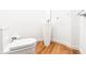 Modern and clean bathroom with a pedestal sink and light wood floors at 1137 Ponce De Leon Ne Ave # 1, Atlanta, GA 30306