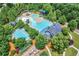 Resort-style pool area with multiple pools, a clubhouse, and playground at 306 Mountain Laurel Walk, Canton, GA 30114