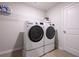 Convenient laundry room with washer, dryer, and ample shelving at 382 Paden Way, Jonesboro, GA 30238