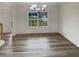 Bright dining room with chandelier and wainscoting at 1340 Lower Falls Dr, Mcdonough, GA 30252