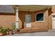 Side entrance with brick steps and planter at 981 Cranbrook Glen Ln, Snellville, GA 30078