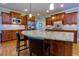 Island kitchen with granite countertops and hardwood floors at 981 Cranbrook Glen Ln, Snellville, GA 30078