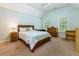 Spacious bedroom with wood-framed bed and ample closet space at 981 Cranbrook Glen Ln, Snellville, GA 30078