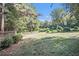Spacious backyard with a large lawn and mature trees at 6280 Wiscasset Nw Pkwy, Dallas, GA 30157