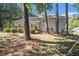 Gray house exterior with a deck nestled among trees at 6280 Wiscasset Nw Pkwy, Dallas, GA 30157