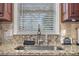 Modern kitchen sink with granite countertop and a sleek faucet at 6280 Wiscasset Nw Pkwy, Dallas, GA 30157