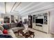 Cozy living room with a large sectional sofa and built-in entertainment center at 6280 Wiscasset Nw Pkwy, Dallas, GA 30157