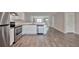 Modern kitchen with granite countertops and stainless steel appliances at 4433 Pinscher St, Union City, GA 30291