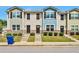 Three-unit townhouse building with gray and blue siding at 4433 Pinscher St, Union City, GA 30291