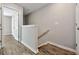 Staircase with wood-look flooring and neutral-colored walls at 4433 Pinscher St, Union City, GA 30291