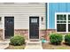 Two-unit townhouse building with gray and blue siding at 4433 Pinscher St, Union City, GA 30291