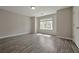 Bright bedroom with hardwood floors and a large window at 4433 Pinscher St, Union City, GA 30291
