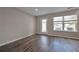 Bright living room with hardwood floors and access to patio at 4433 Pinscher St, Union City, GA 30291