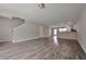 Large living room with gray vinyl flooring and stairs at 4433 Pinscher St, Union City, GA 30291