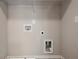 Laundry room with built-in shelving and hookups for a washer and dryer at 4433 Pinscher St, Union City, GA 30291