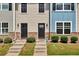 Three-unit townhouse building with gray and blue siding at 4433 Pinscher St, Union City, GA 30291