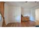 Well-lit bedroom with double doors to closet, hardwood floors and neutral decor at 294 Puckett Se Rd, Emerson, GA 30137