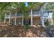 Two-story home with stone accents and a large wraparound porch at 294 Puckett Se Rd, Emerson, GA 30137
