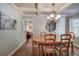 Formal dining room with hardwood floors, chandelier and large mirror at 294 Puckett Se Rd, Emerson, GA 30137
