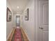 Bright hallway with hardwood floors and a runner rug, leading to other rooms at 294 Puckett Se Rd, Emerson, GA 30137