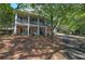Two-story home with stone facade and a large wraparound porch at 294 Puckett Se Rd, Emerson, GA 30137