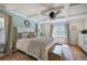 Main bedroom with hardwood floors, large windows, and a ceiling fan at 294 Puckett Se Rd, Emerson, GA 30137