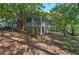 Side view of two-story house with porch and stone accents at 294 Puckett Se Rd, Emerson, GA 30137