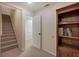 Basement with carpeted stairs, storage closet and built-in bookcase at 294 Puckett Se Rd, Emerson, GA 30137