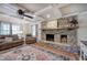 Living room with a stone fireplace, hardwood floors, and coffered ceiling at 294 Puckett Se Rd, Emerson, GA 30137