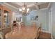 Bright dining room with a large table, chandelier, and hardwood floors at 294 Puckett Se Rd, Emerson, GA 30137