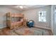 Bright bedroom with a bunk bed, a sitting area and hardwood floors at 294 Puckett Se Rd, Emerson, GA 30137